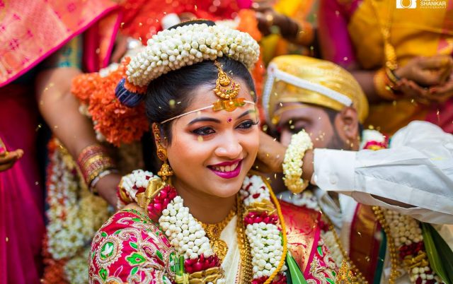 Image Representing A Close-up View of Stunning Indian Bride wearing a beautiful smile on her face during her Wedding Ritual.